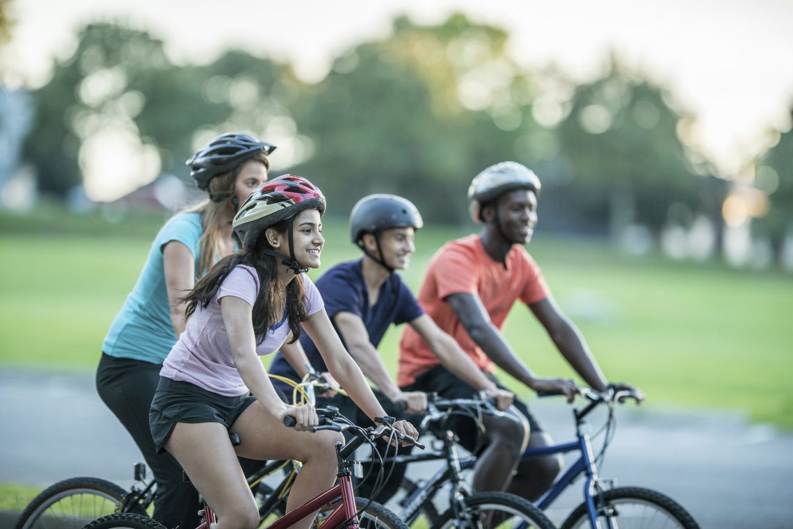 Young adults out riding bikes. Traffic Injury Research Foundation