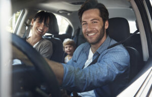 Cropped portrait of a young family on a roadtrip