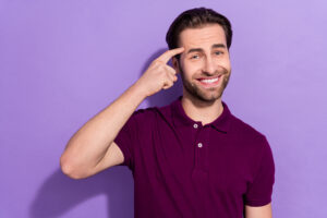 Photo of young guy purple polo isolated on violet color background.