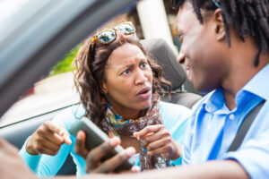 Mother upset at teenager using his cell phone while driving.
