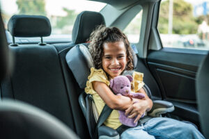 Portrait of girl on the back seat of a car