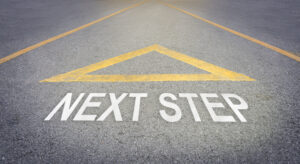 Arrow sign pointing to the forward road for next step concept.